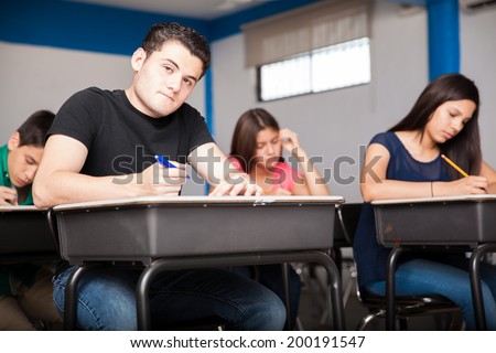 Many teens solving an admission test for high school