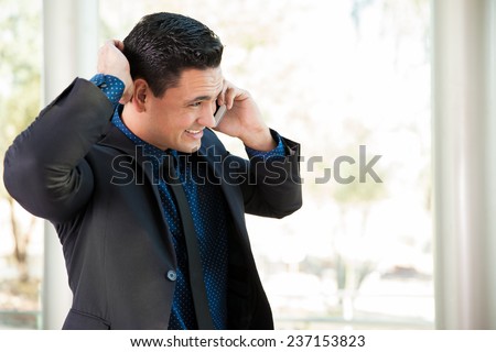 Portrait of a young businessman hearing some bad news during a call on his cell phone