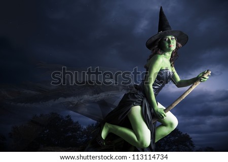 Sexy witch on a dark background