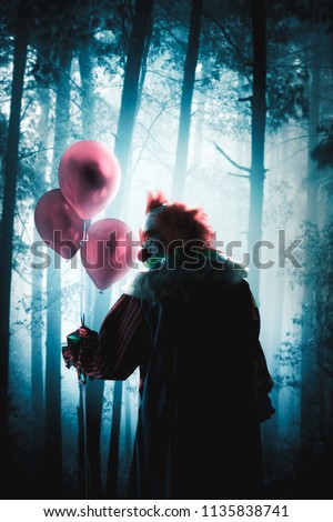 creepy clown with balloons in a forest
