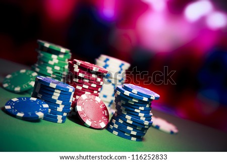 Poker Chips on a gaming table Poker Chips on a gaming table