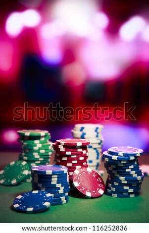Poker Chips on a gaming table Poker Chips on a gaming table