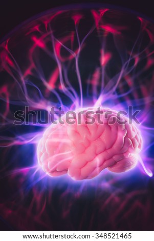mind power concept with human brain and light rays
