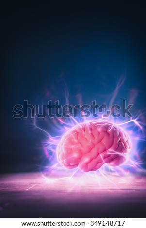high contrast image, mind power concept with human brain and light rays
