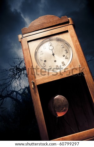 dark antique clock at Halloween night