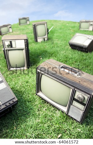 field of grass with tv's