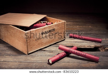 high contrast photo of dynamite sticks on a box