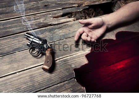 gun with smoke and blood on the floor, suicide concept