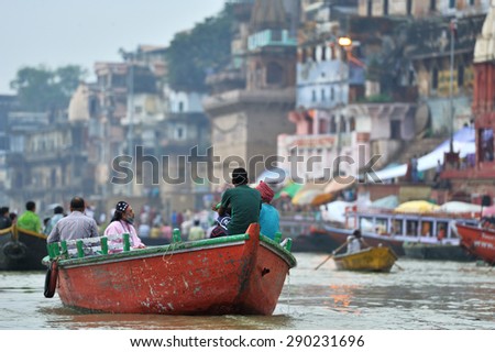 Varanasi, India- October 4, 2013: Tourists and local people are traveling on the boat in Ganga River.