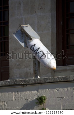 HERAKLION, CRETE - SEPTEMBER 25: Unexploded missile launched during the bombings of Crete in 1941 showed near the Cathedral of Saint Minas at Heraklion in Crete on September 25, 2012