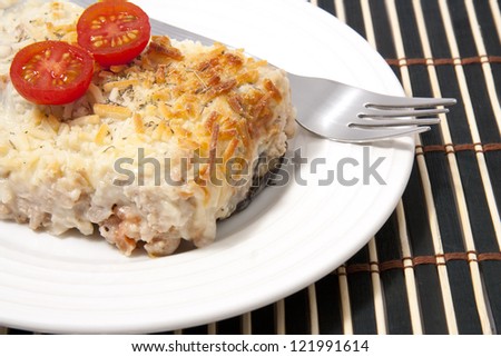 Traditional moussaka under white bechamel sauce and cheese gratin. Greek cuisine.
