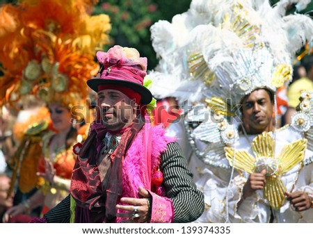 BERLIN - MAY 19: Unidentified men dancers dressed in multicolored carnival costumes perform at the annual Berlin Carnival of Cultures on May 19, 2013 in Berlin.