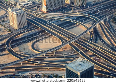 Highway road intersection in Dubai, UAE in the evening. Downtown Burj Dubai.