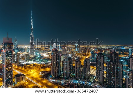 Aerial view of Dubai\'s business bay architecture by night.