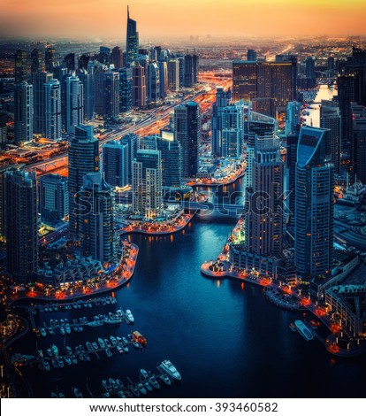 Dubai Marina rooftop skyline by night. United Arab Emirates. Travel background.