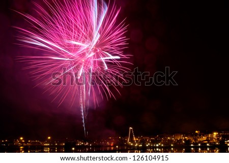 Fireworks on new year\'s eve night in the port of Oskarshamn, Sweden. Long time exposure