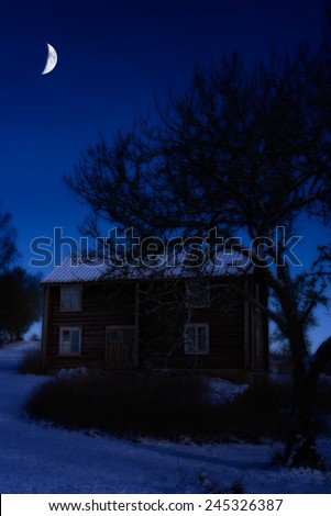 Old farmhouse in the small village Sinnerbo, Sweden, in the darkness of a winter night
