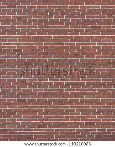 Red brick wall with cement grout as a rustic old brownstone architectural design element and a rough outdoor building structure textured background.