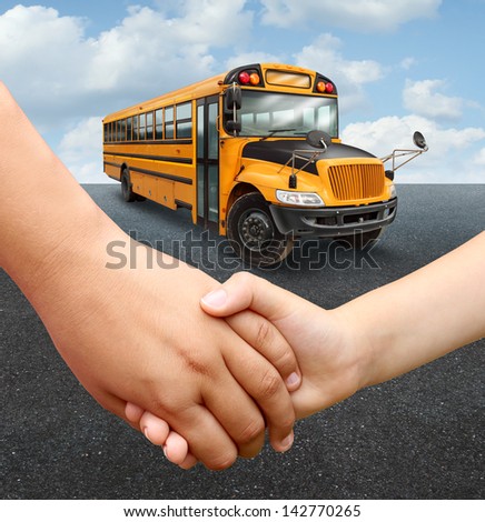 School children bus with two young students of elementary age holding hands preparing to go into the yellow transport vehicle as an education and learning concept.