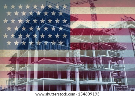 American Economic Development business and industry concept with the flag of the United States and a construction site with a concrete structure in the process of being built.