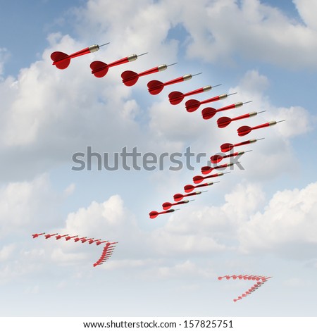 Mobile strategy business metaphor as a group of red darts in a migratory bird formation changing course and adapting to new economic climate and searching new goals and aiming for opportunities.