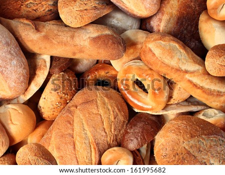 Bread Background Staple Food Concept With A Group Of Baked Goods From A Bakery Or Home Cooking Made From Whole Wheat And Grains With Breads As Pumpernickel Pita Focaccia Bagel Made From Dough.
