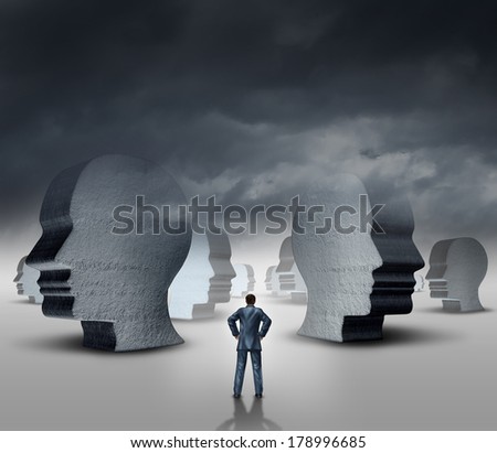 Recruitment strategy and human resources business concept as a businessman standing in front of a landscape with three dimensional head sculptures as symbols of employment hiring and career issues.