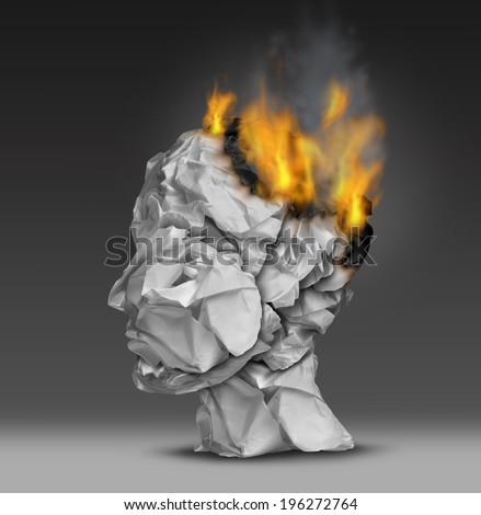 Headache and mental illness concept as a group of crumpled office paper shaped as a human head that is on fire burning the brain as a symbol and metaphor for emotional stress at work or dementia.
