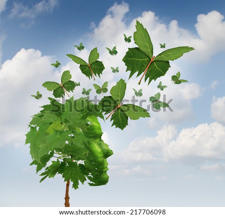 Creative communication and intelligent marketing concept as a tree shaped as a human head with flying leaves as leaf butterflies spreading the message and sharing innovative thoughts and imagination.