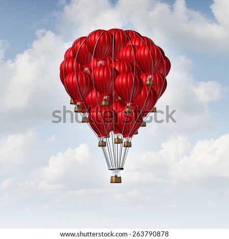Group concept as a team of red hot air balloons joined together as a symbol for teamwork unity and collaboration solidarity with people being lead by an individual manager.