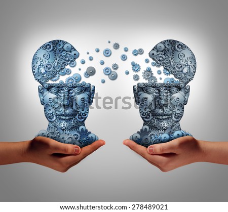 Sharing technology business concept as hands holding two human heads made of gears and cog wheels exchanging information as a symbol and financial metaphor for buying and selling or share data.