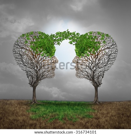 Mutual support and saving one another as a benefit to each other business concept as two sick trees with new leaves growth emerging shaped as a human head providing a revival for success.