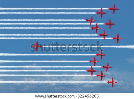 Different way business concept or going the opposite direction as a metaphor for individual thinking and new innovative ideas as airplanes flying as a group except for one jet.