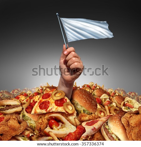 Junk food surrender and giving up fatty food or quitting a high fat lifestyle and dieting help concept as a hand holding a white flag drowning in a heap of greasy snacks.