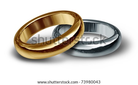 stock photo Gold and silver wedding rings resting on an isolated 