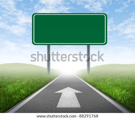 Clear goals on an open straight road highway sign with green grass and asphalt street as a concept of journey to a focused destination resulting in success and happiness with an arrow on the pavement.