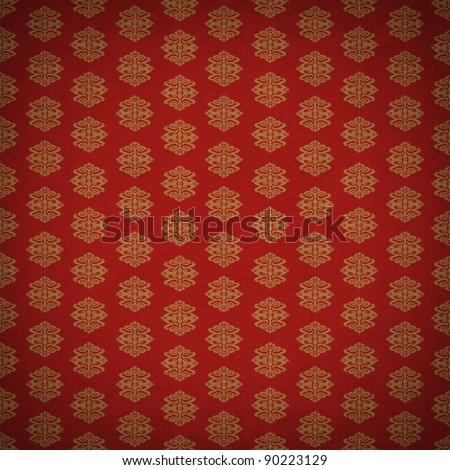 Red and gold leaf antique old wallpaper with an ancient retro style victorian pattern style with a textured old fashioned design element.
