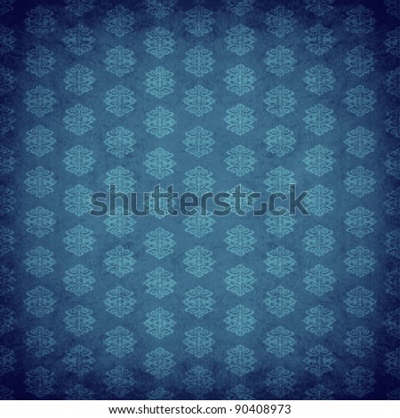 Blue antique old wallpaper with an old retro style victorian pattern style with a textured old fashioned design element.
