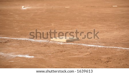 Ball near pitcher\'s mound and base