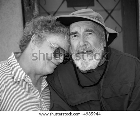 Older couple sitting on a porch in black and white