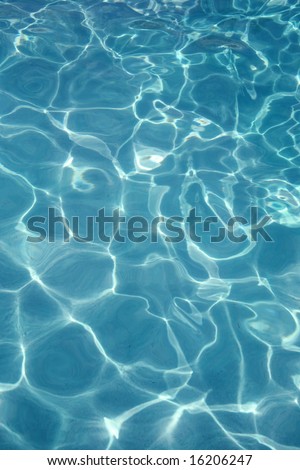 Shimmering blue swimming pool sports water background