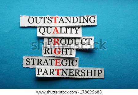 Target  acronym  in business concept, words on cut paper hard light