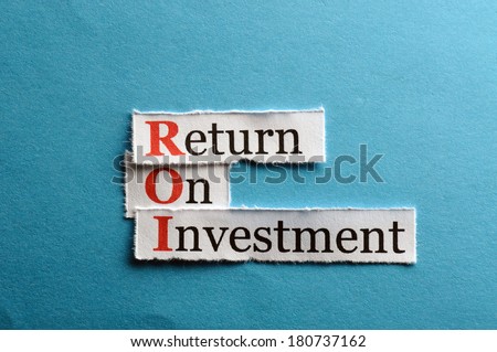 ROI acronym on blue paper, Return On Investment