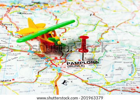 Red push pin pointing at Pamplona ,Spain  map airplane