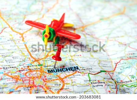 Close up of Munchen,Germany map with red pin and airplane - Travel concept