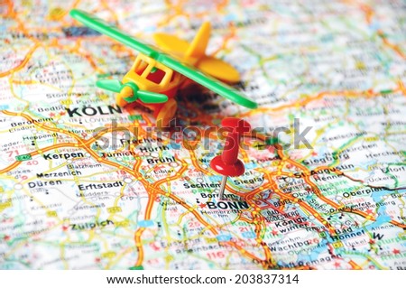 Close up of Bonn, Germany  map with red pin and airplane - Travel concept