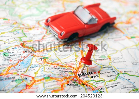 map of Bern, Swiss and red pin  and a car