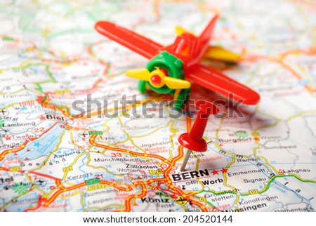 map of Bern, Swiss and red pin and airplane toy