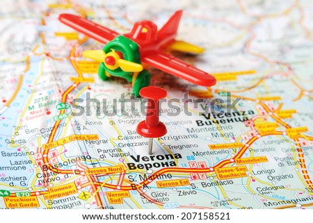 Close up of  Verona , Italy map with red pin and airplane   - Travel concept