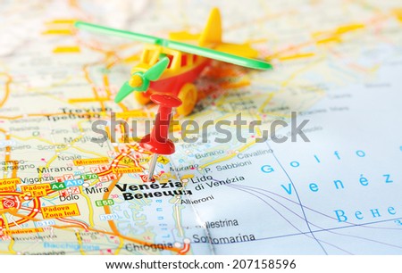 Close up of  Venice , Italy map with red pin and airplane    - Travel concept